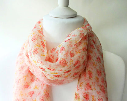 lightweight pink ditsy floral chiffon scarf on mannequin