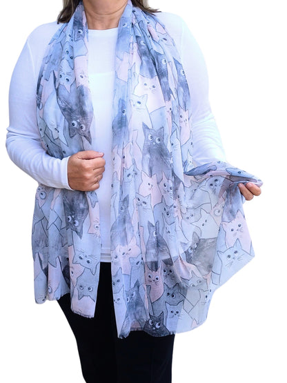 Lightweight scarf with a charming cat pattern in shades of grey, blue, and soft pink. Stylish and comfortable accessory.