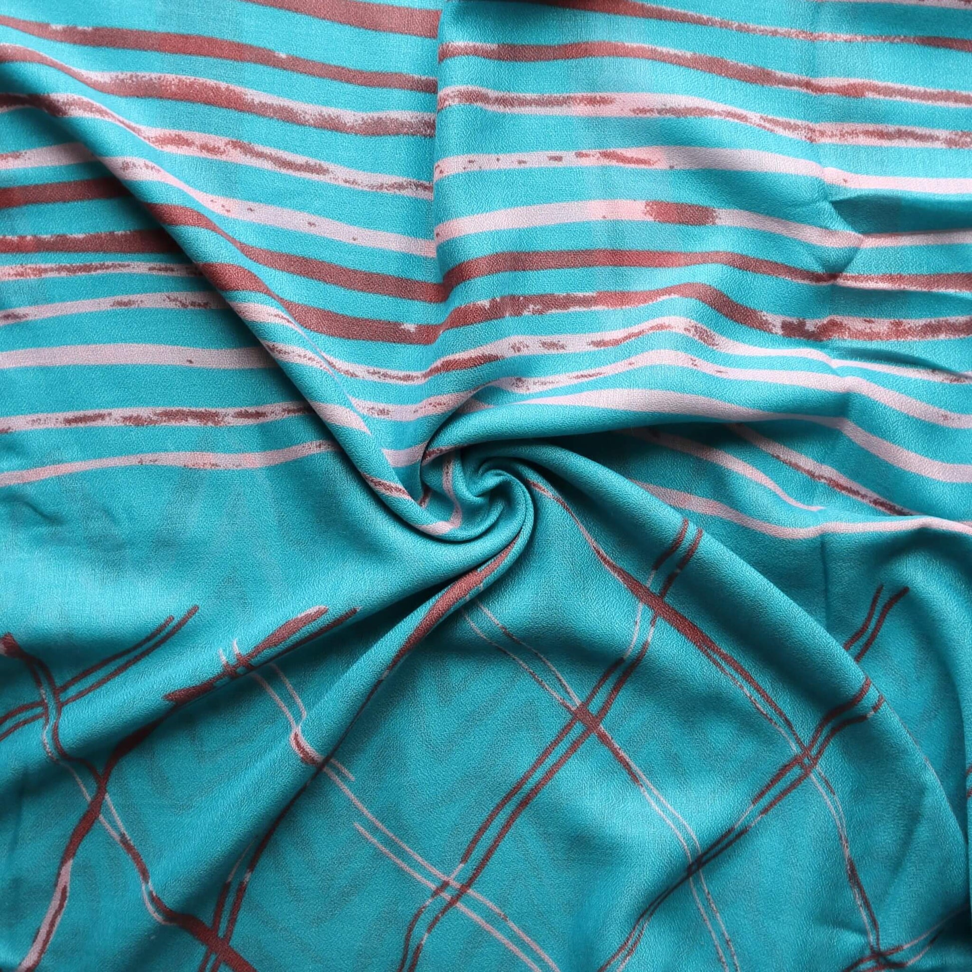 Aurora's Array: Close-up of a soft, lightweight scarf with horizontal stripes in turquoise, light pink, and brown, transitioning to a plaid pattern in turquoise and brown.