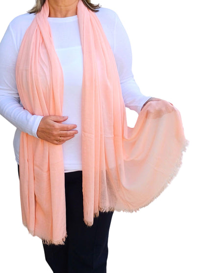 Oversized lightweight scarf in salmon pink with frayed finish