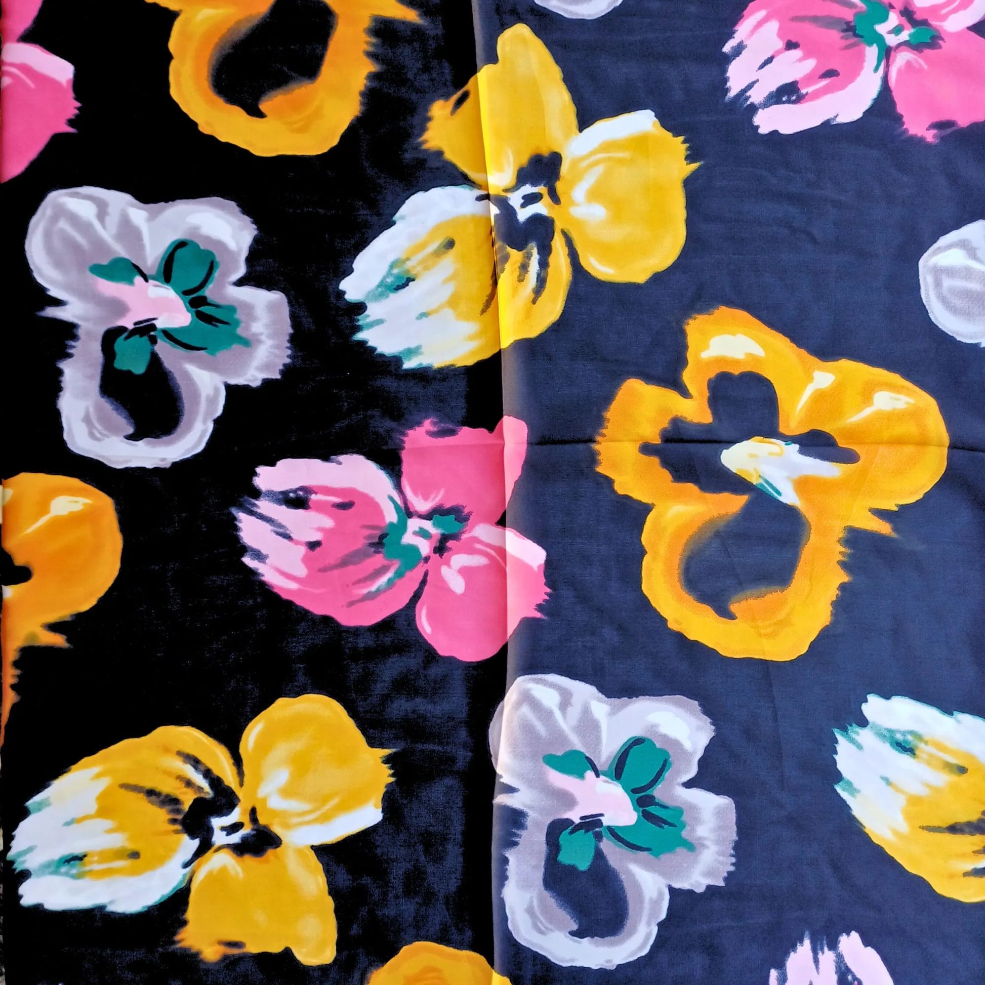 Black floral silky feel square scarf laid open showing pattern