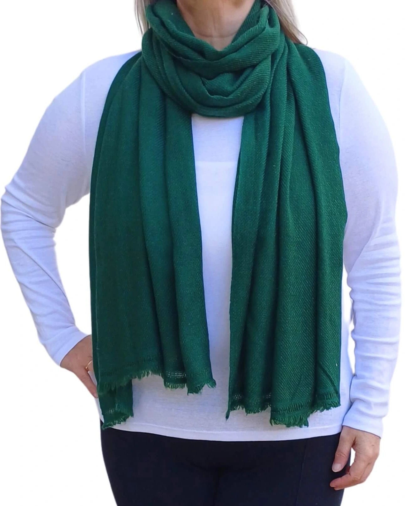Bottle green handmade plain cashmere scarf from Auroras Array shown draped around the neck