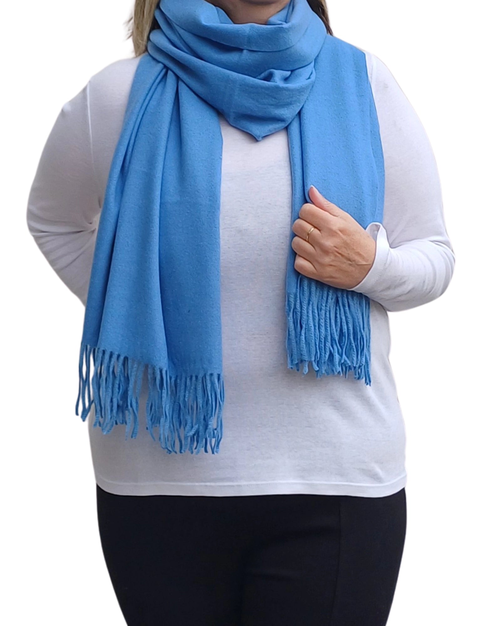 Blue cashmere blend winter scarf wrapped around shoulders, soft medium weight fabric with tassels, classic plain design