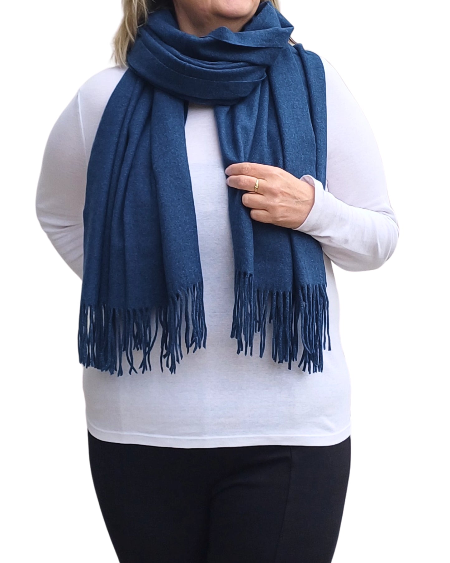 Navy cashmere blend winter scarf wrapped around shoulders, soft plain fabric, medium weight for warmth and style