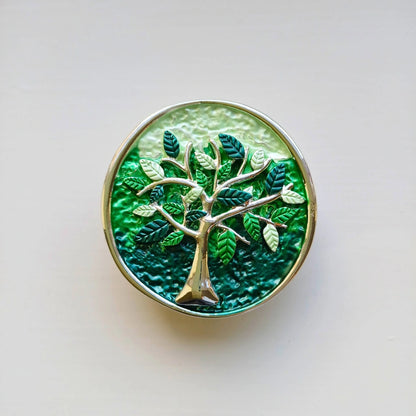 colourful tree of life magnetic brooch green on wooden background