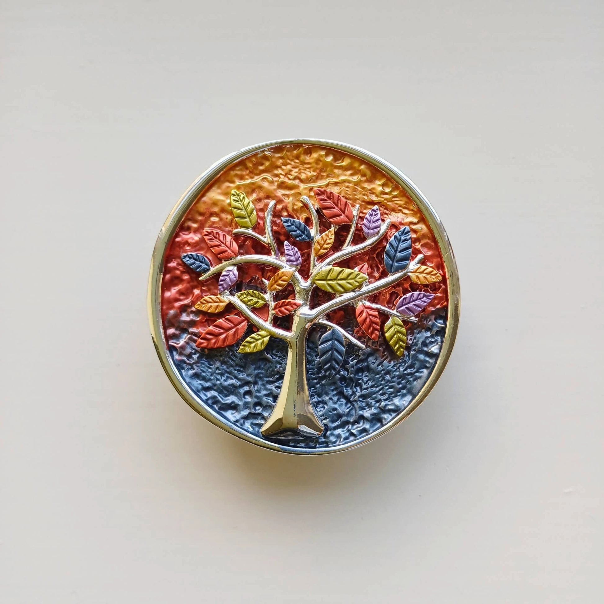 colourful tree of life magnetic brooch multi colours on wooden background