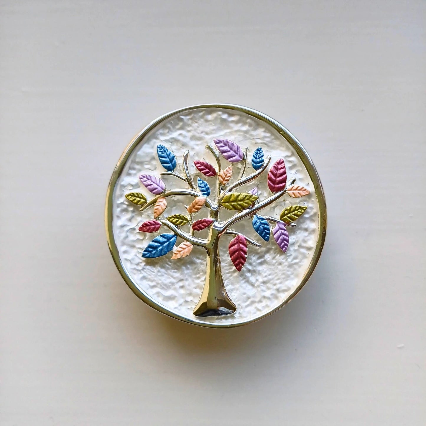 colourful tree of life magnetic brooch white on wooden background