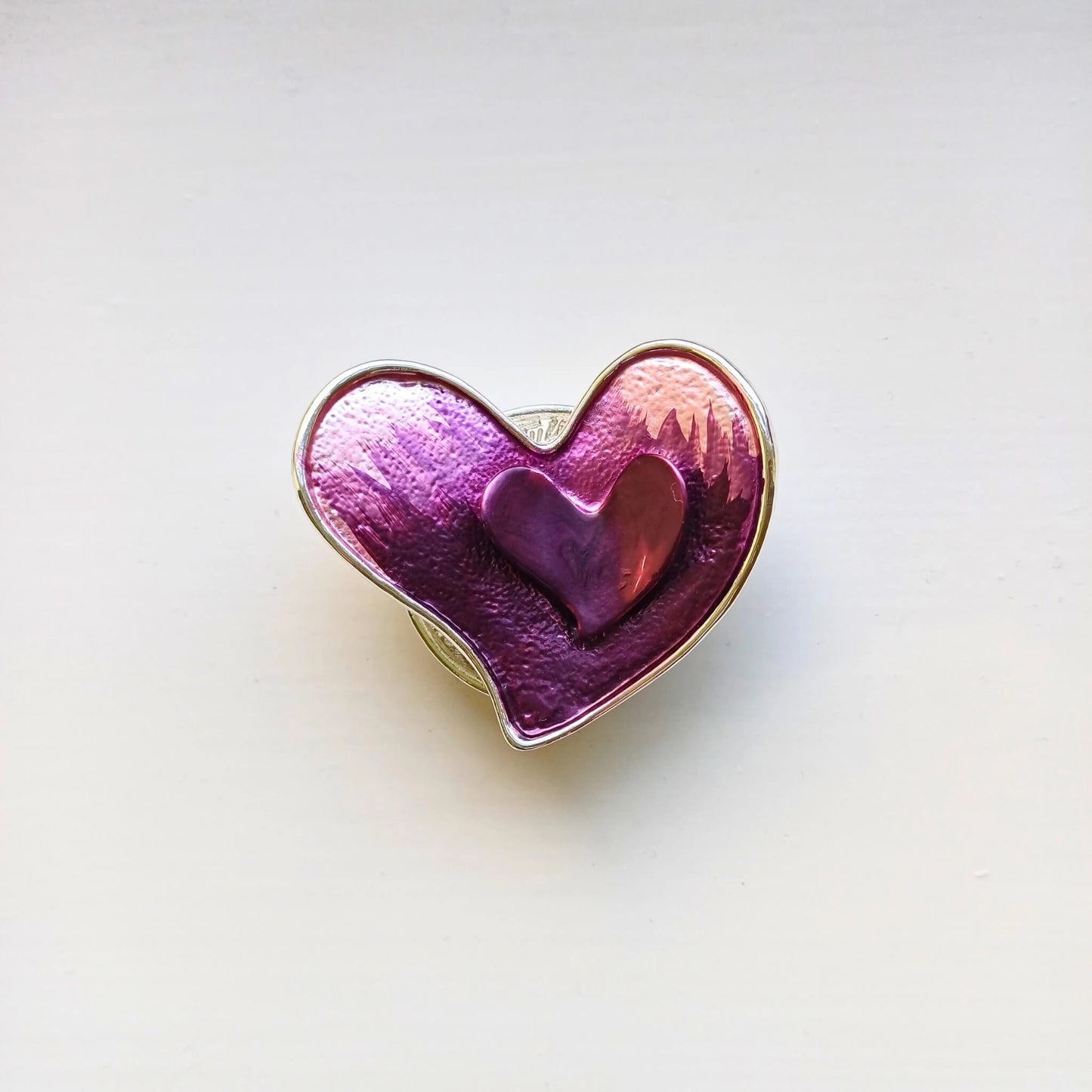 double heart magnetic brooch pink on wooden background