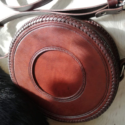 Back of round leather crossbody bag with hand-laced edges – Equina