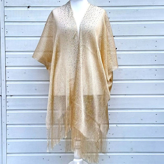 Gold colour kimono on a mannequin against a light wooden panel background