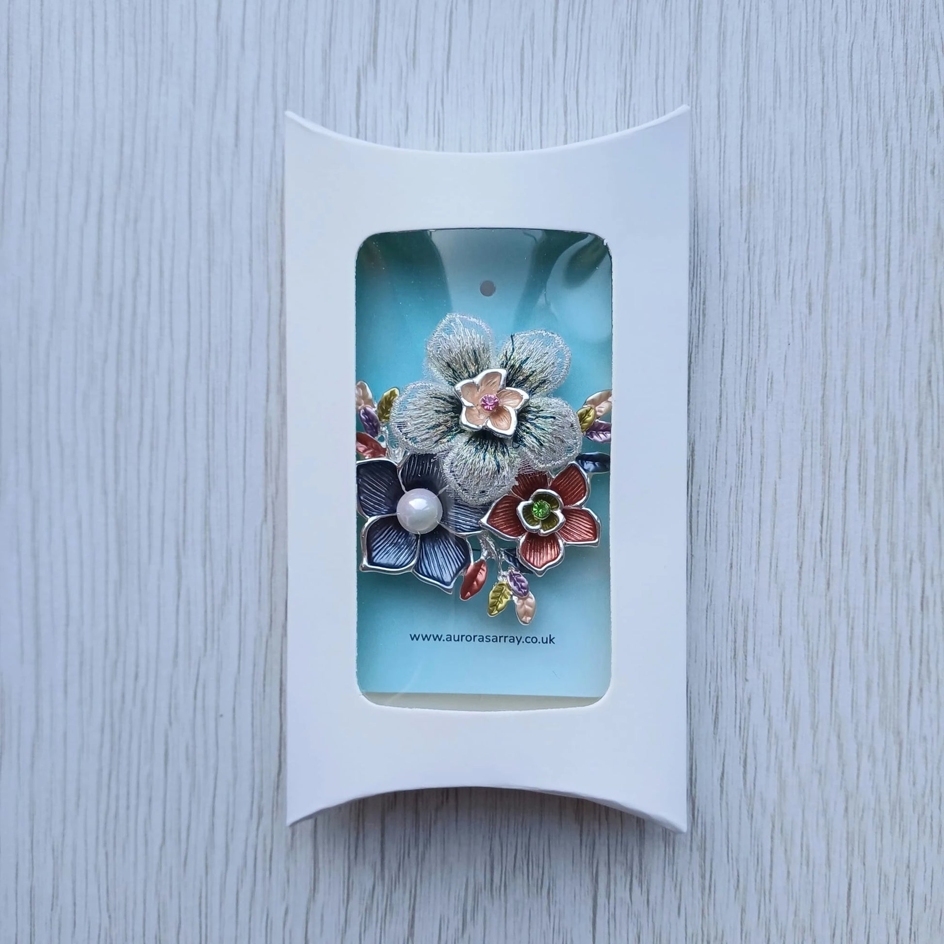 Magnetic floral brooch presented in white gift box packaging from Auroras Array