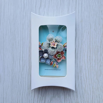 Magnetic floral brooch presented in white gift box packaging from Auroras Array