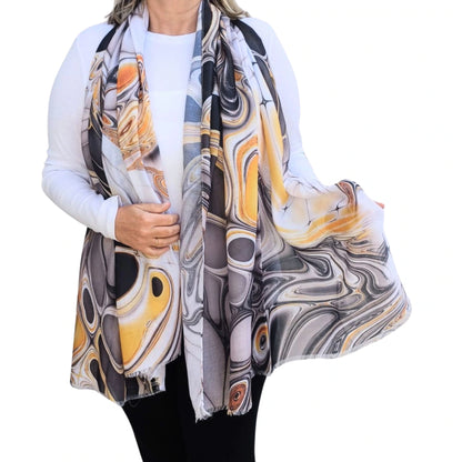 Lightweight marble style scarf in orange and grey shown draped at the front