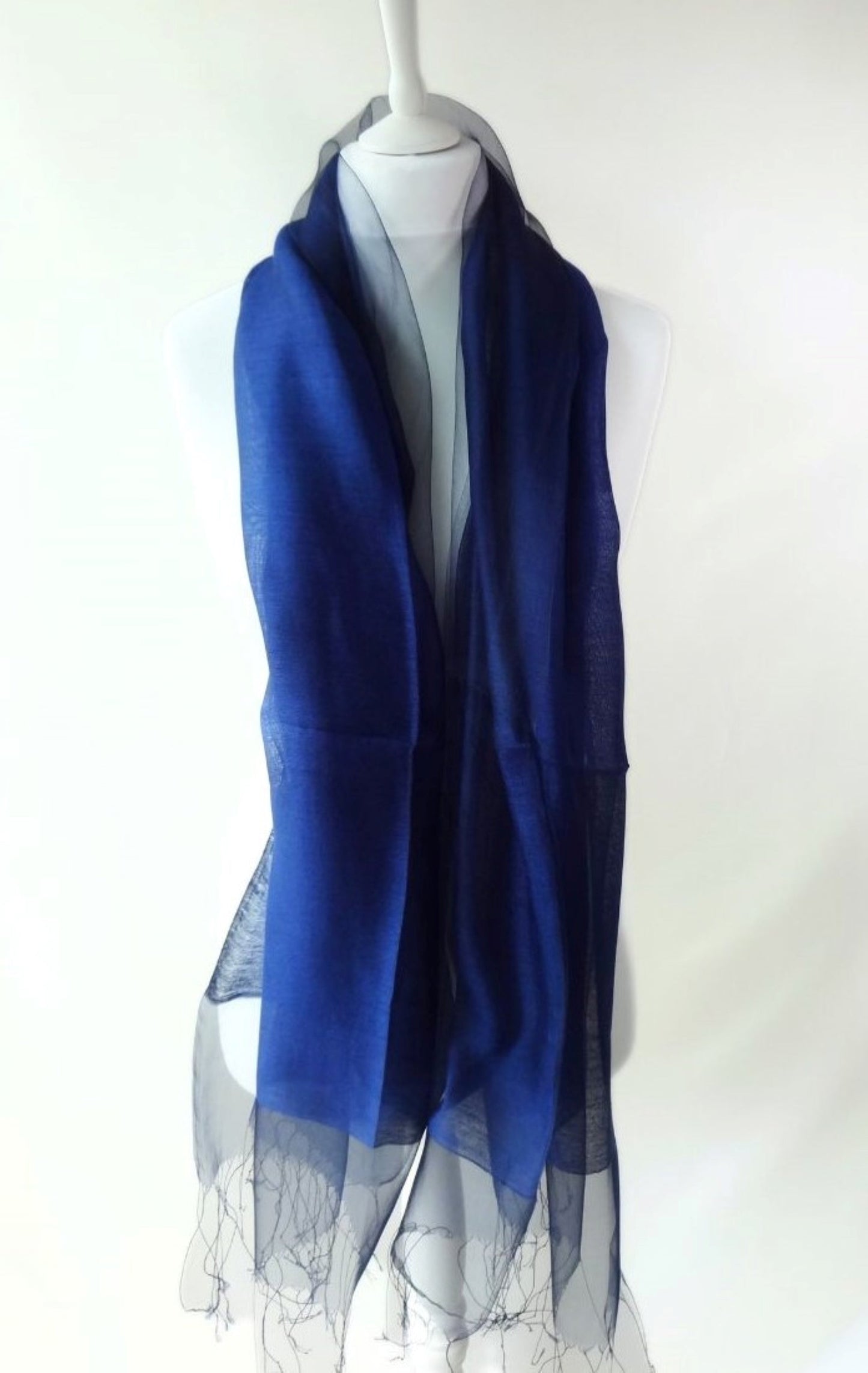 Navy blue organza silk scarf displayed on mannequin with sheer layer