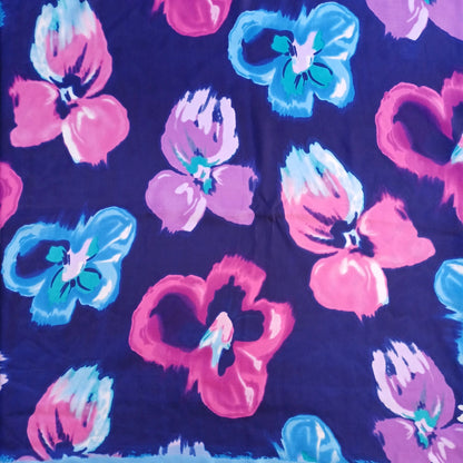 Navy blue floral silky feel square scarf laid open showing pattern
