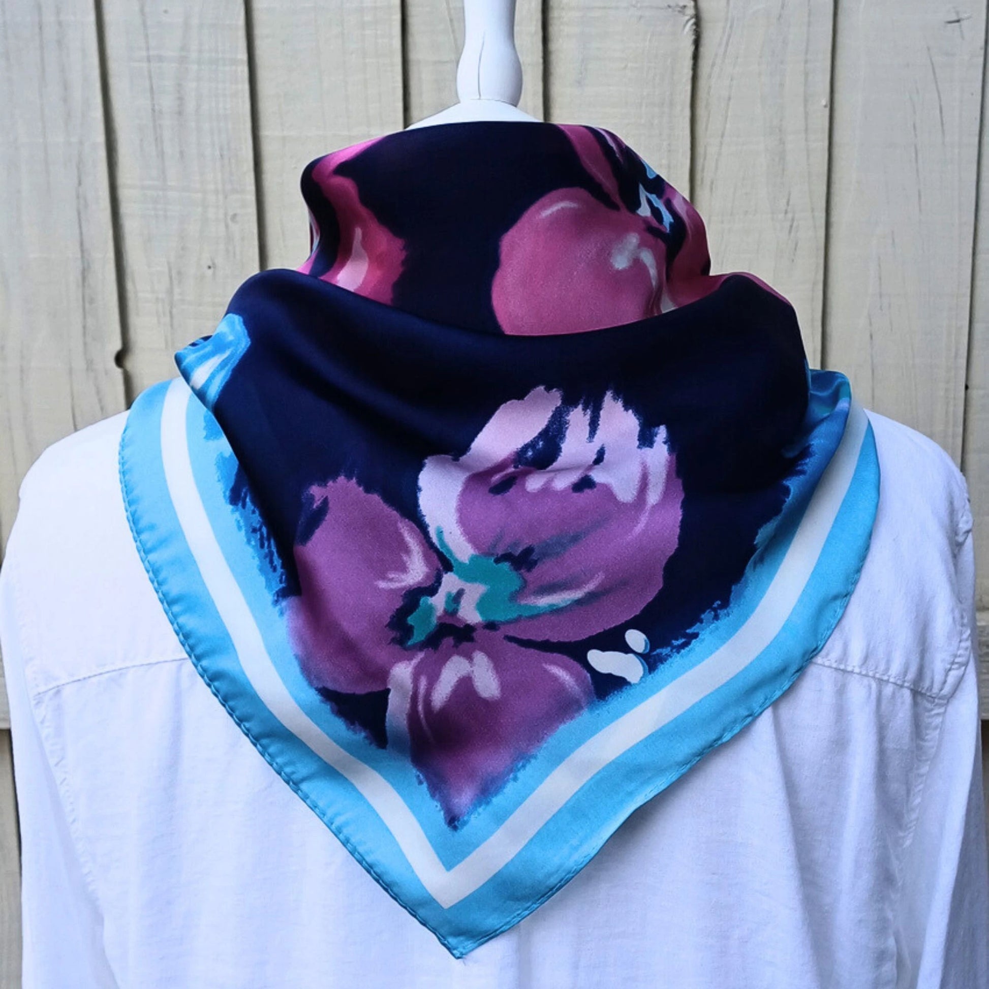 Navy blue floral silky feel square scarf styled with white shirt