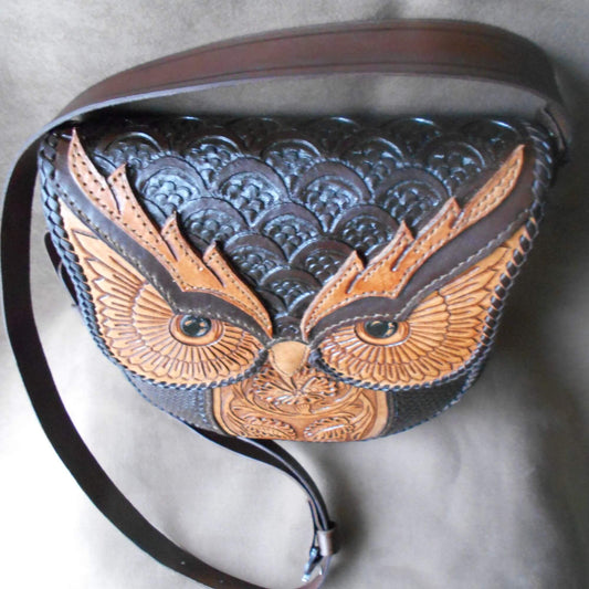 Close-up of tooled owl face and floral leather pattern – handmade