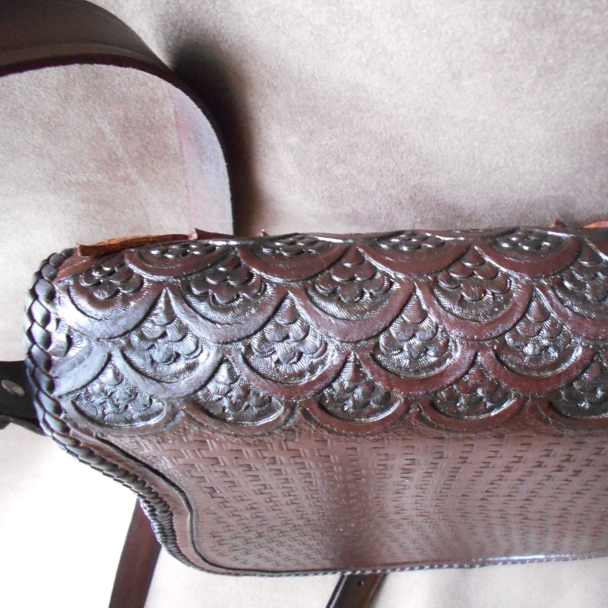 Top and back view of owl crossbody bag showing scaled leather tooling