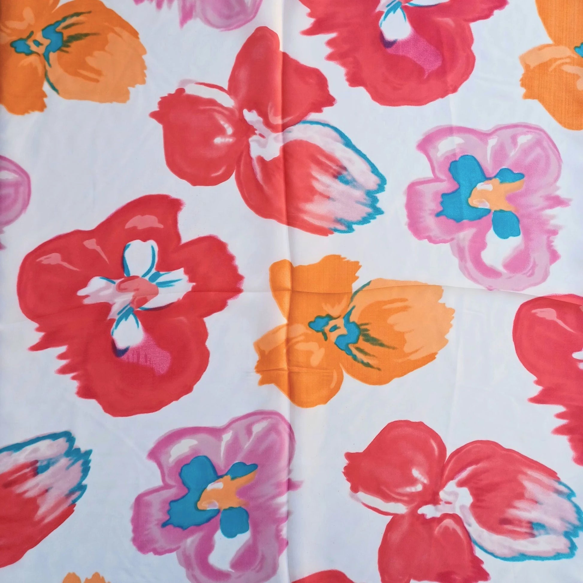 Pink orange floral silky feel square scarf laid open showing pattern