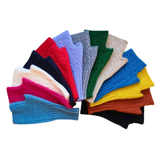 cable knit fingerless gloves in a full rainbow of colours arranged in a fan shape