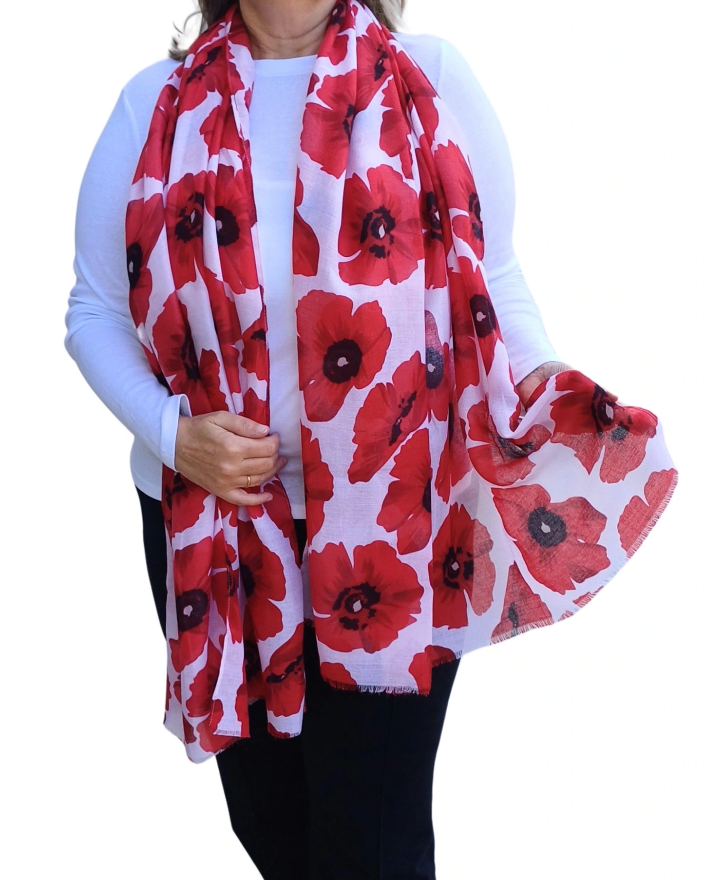 Red poppy scarf worn on model, draped loosely over shoulders