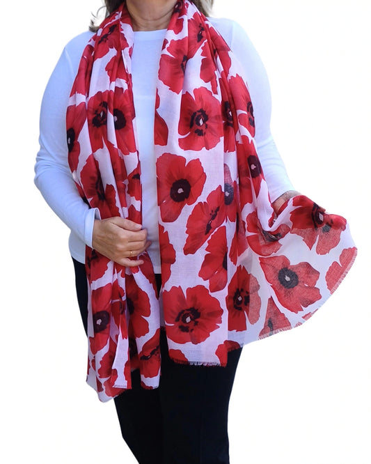 Red poppy scarf worn on model, draped loosely over shoulders