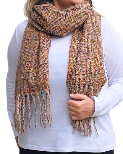Soft woven taupe beige winter scarf with tassels from Auroras Array wrapped around the neck ideal for winter layering