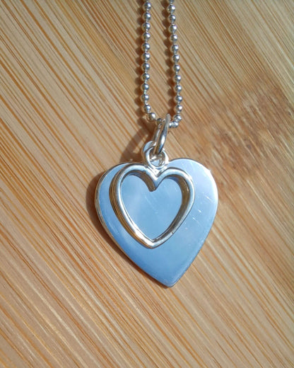 Sterling silver double heart pendant necklace on chain, plain and outline design