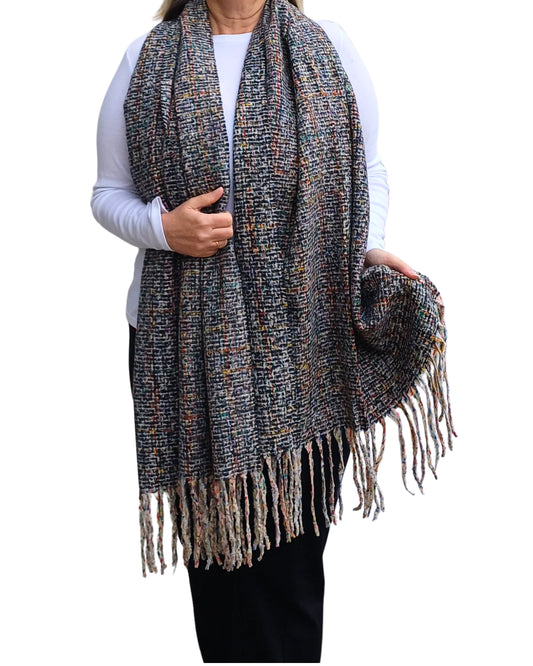 Black mix tweed blanket scarf with tassels, shown draped over the shoulders.