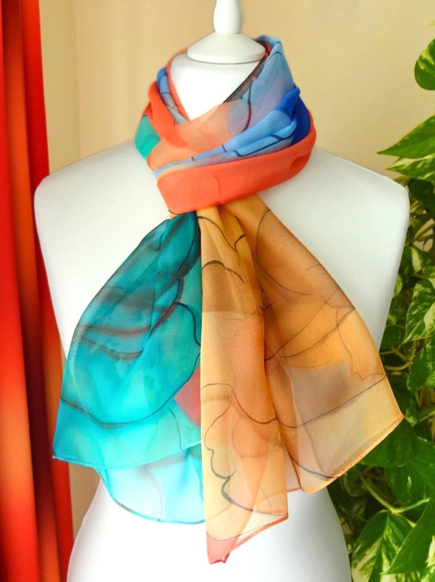 Lightweight chiffon scarf with vivid flower print in orange, turquoise and coral hues