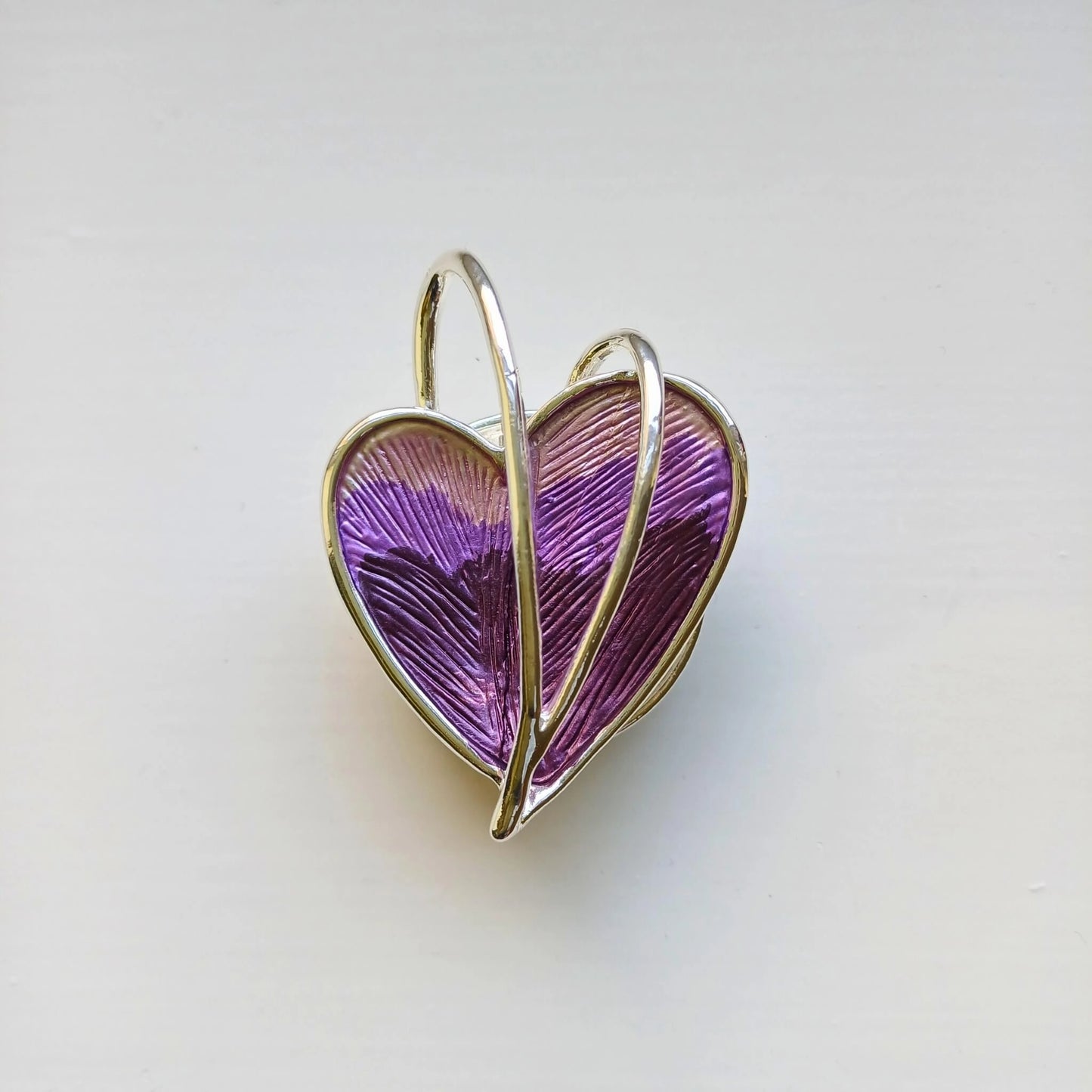 wrapped heart magnetic brooch purple on wooden background