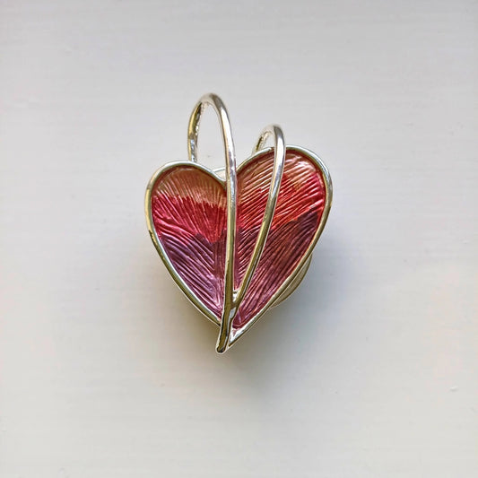 wrapped heart magnetic brooch red on wooden background